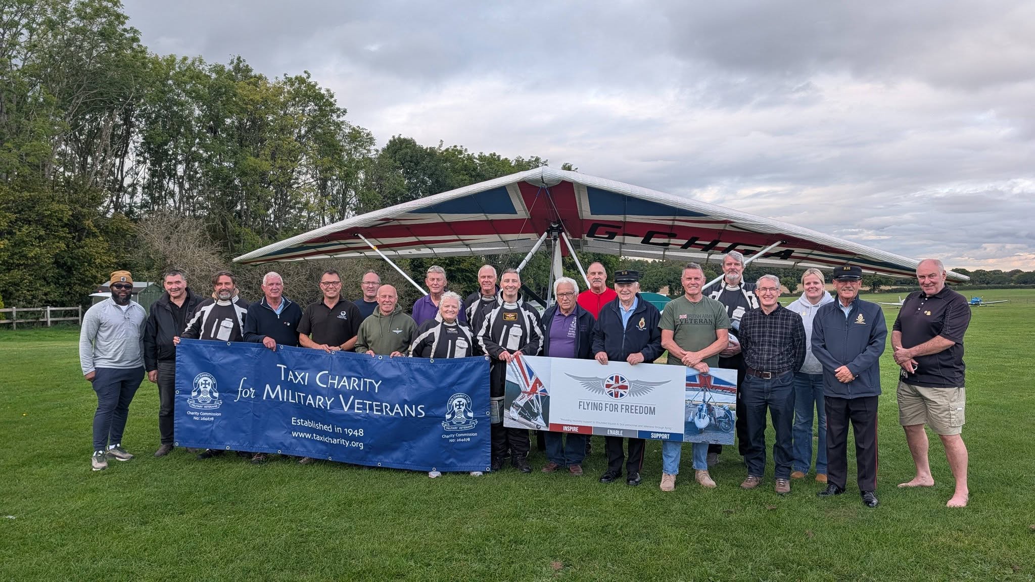 Veterans, pilots and supporters at the Flying For Freedom and Taxi Charity for Military Veterans flight experience day at Popham Airfield